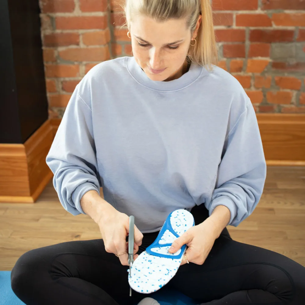 Placing PowerStep Bridge insoles into a shoe