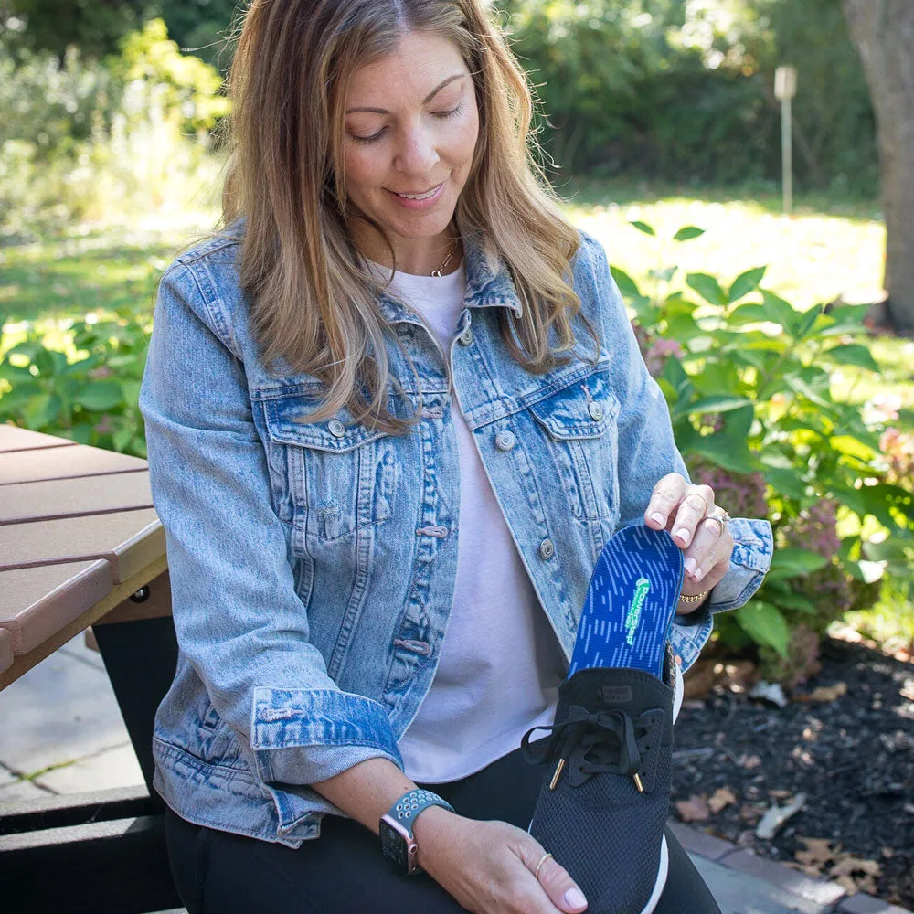 Placing PowerStep Pinnacle High insoles into a shoe