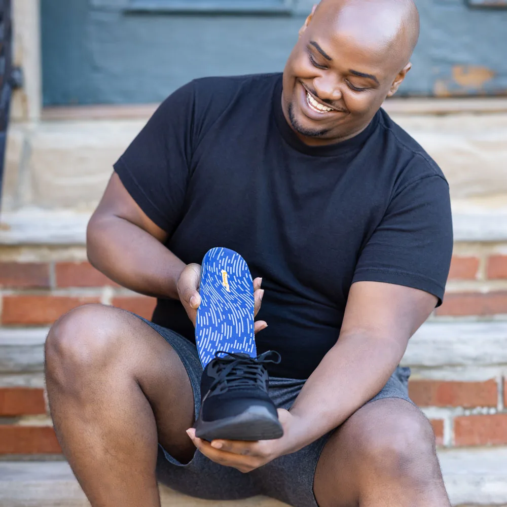 Placing PowerStep Pinnacle Low insoles into a shoe