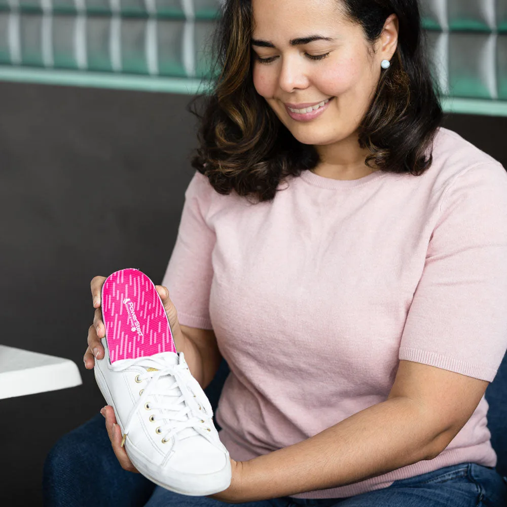 Placing PowerStep Pinnacle Pink insoles into a shoe