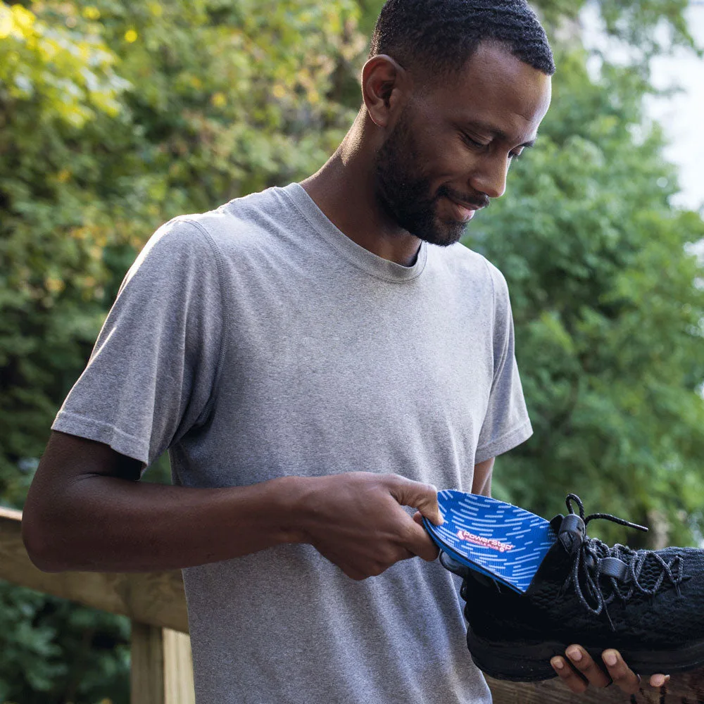 Placing PowerStep Pinnacle Plus Met insoles into a shoe